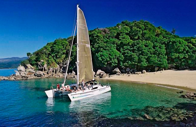 Amazing view of a Sailing boat in a bay of the Abel Tasman Park.