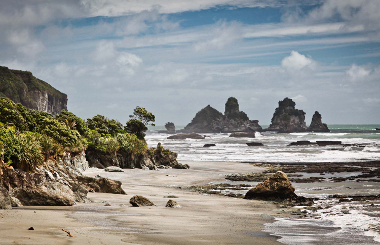New Zealands West Coast and its wild pounding waves and craggy cliff faces.