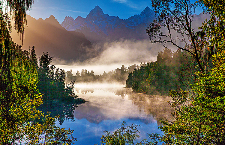 Lake Matheson with Southern Alps behind