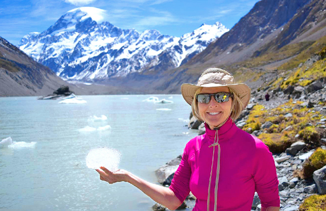 A woman holding ice during the Hooker Valley Track.
