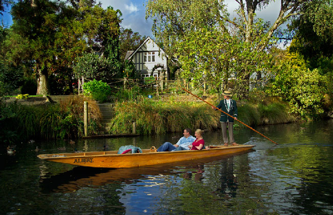 Three people punting the Avon River.