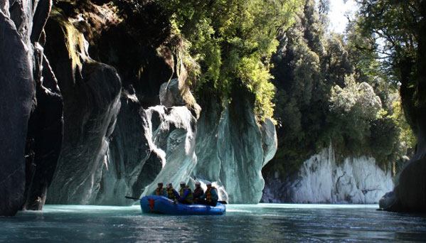 The Whataroa River at its best, deep flowing waters passing stunning limestone cliff faces.