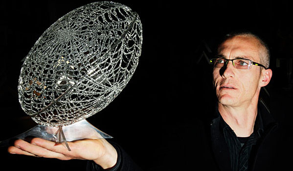 Considered Fine Art in New Zealand: Blenheim artist Terry Stewart displays the rugby ball sculpture he created from spider web.