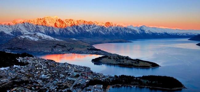 Queenstown City with a red glow on the mountains