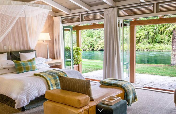 Exclusive Huka Lodge on the edge of the might Waikato River - emerald green perfection.