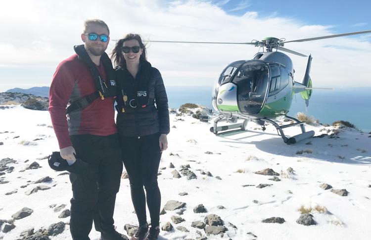 clients enjoying scenic heli tour with snow landing