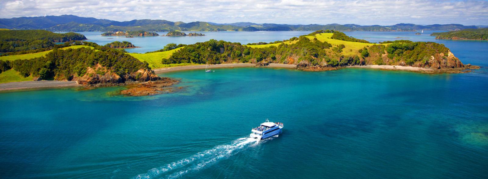 A ferry crosses the tranquil of the Bay of Islands in Northland.