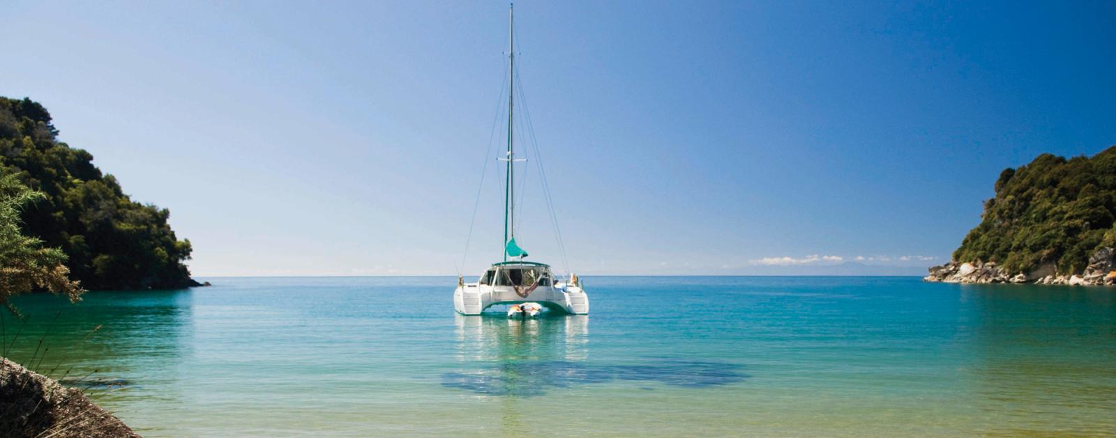 Sailing adventure in the tranquil waters of Abel Tasman National Park.