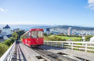 Wellington cable car on tracks with city in background