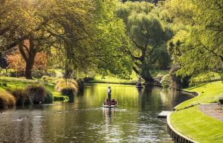 Punting boatman paddling on Avon River