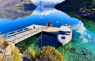 Lake Wānaka cruise and island nature walk with boat at jetty