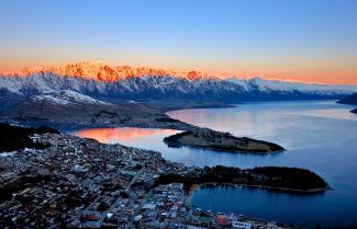 Queenstown City with a red glow on the mountains