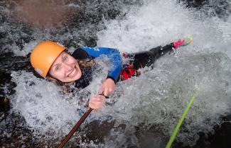 Get very wet canyoning on the West Coast.